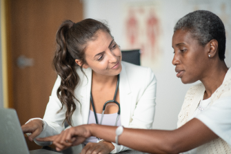 Healthcare provider and a patient looking at a computer screen