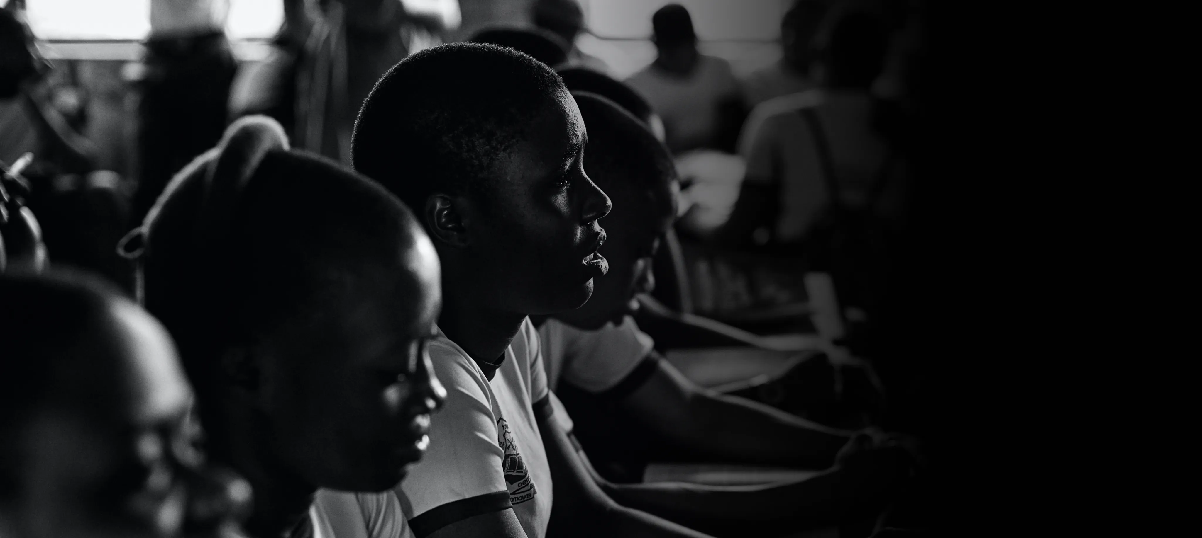 A group of students facing forward in a classroom