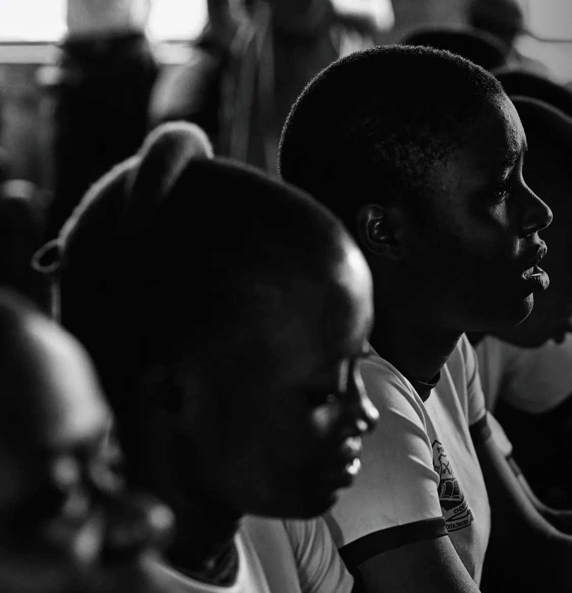 A group of students facing forward in a classroom