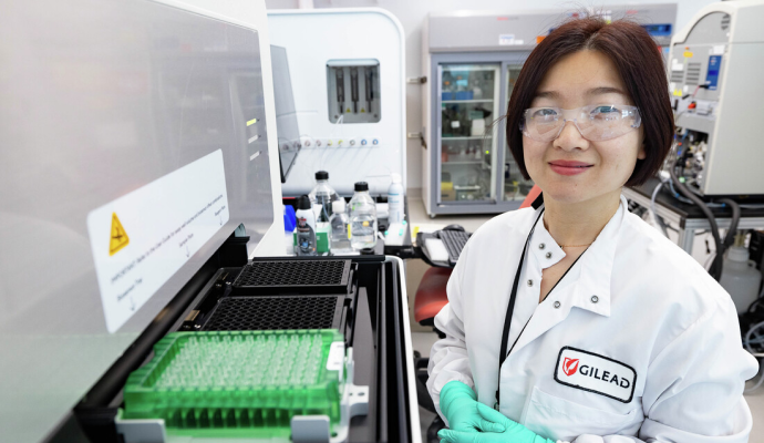 A Gilead scientist smiling