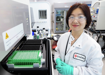 A Gilead scientist smiling