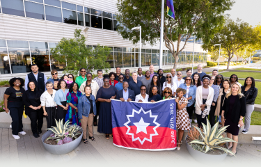 A group of people holding flag