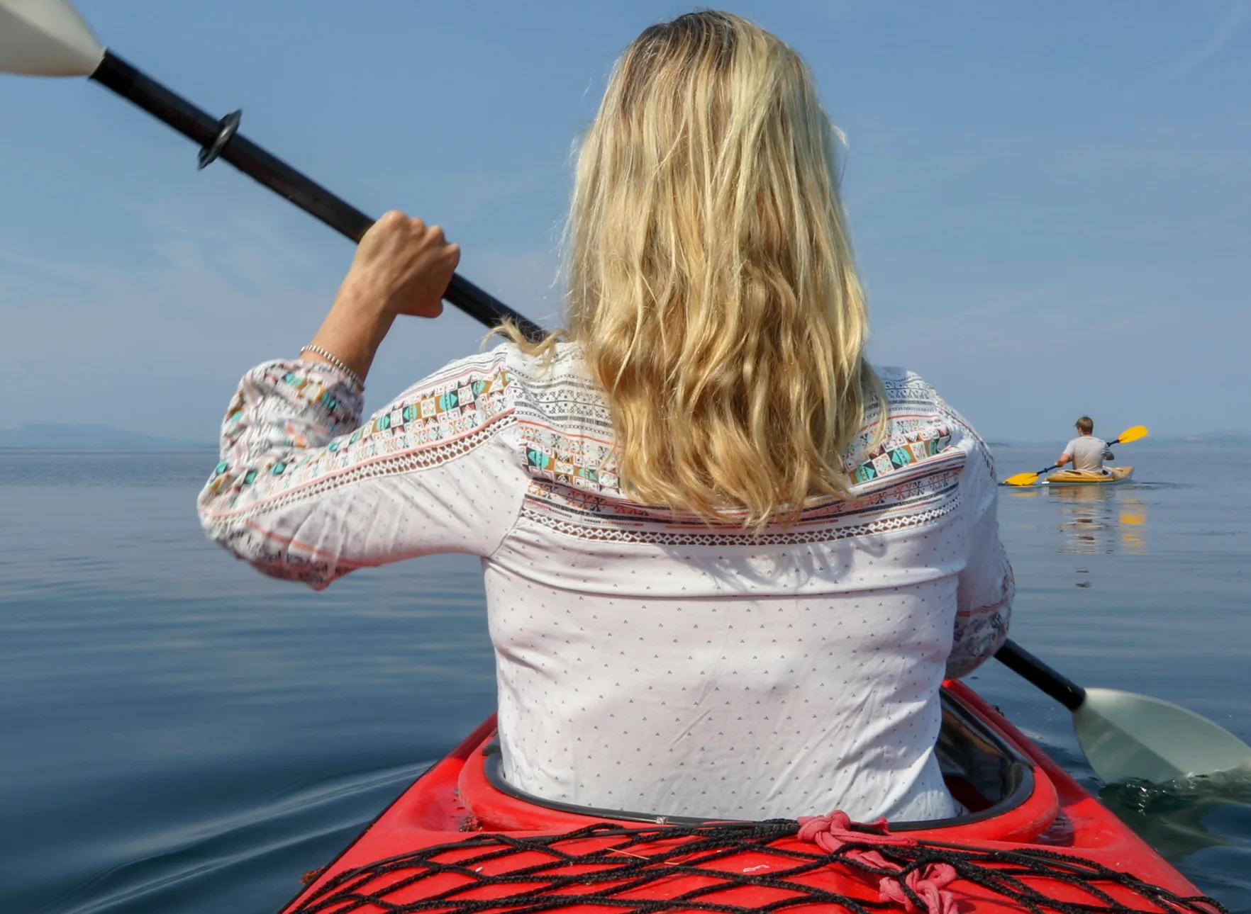 Inflammation-Woman-Paddles-Kayak-Across-Lake