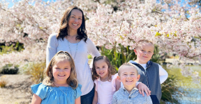 Woman with four kids outside 