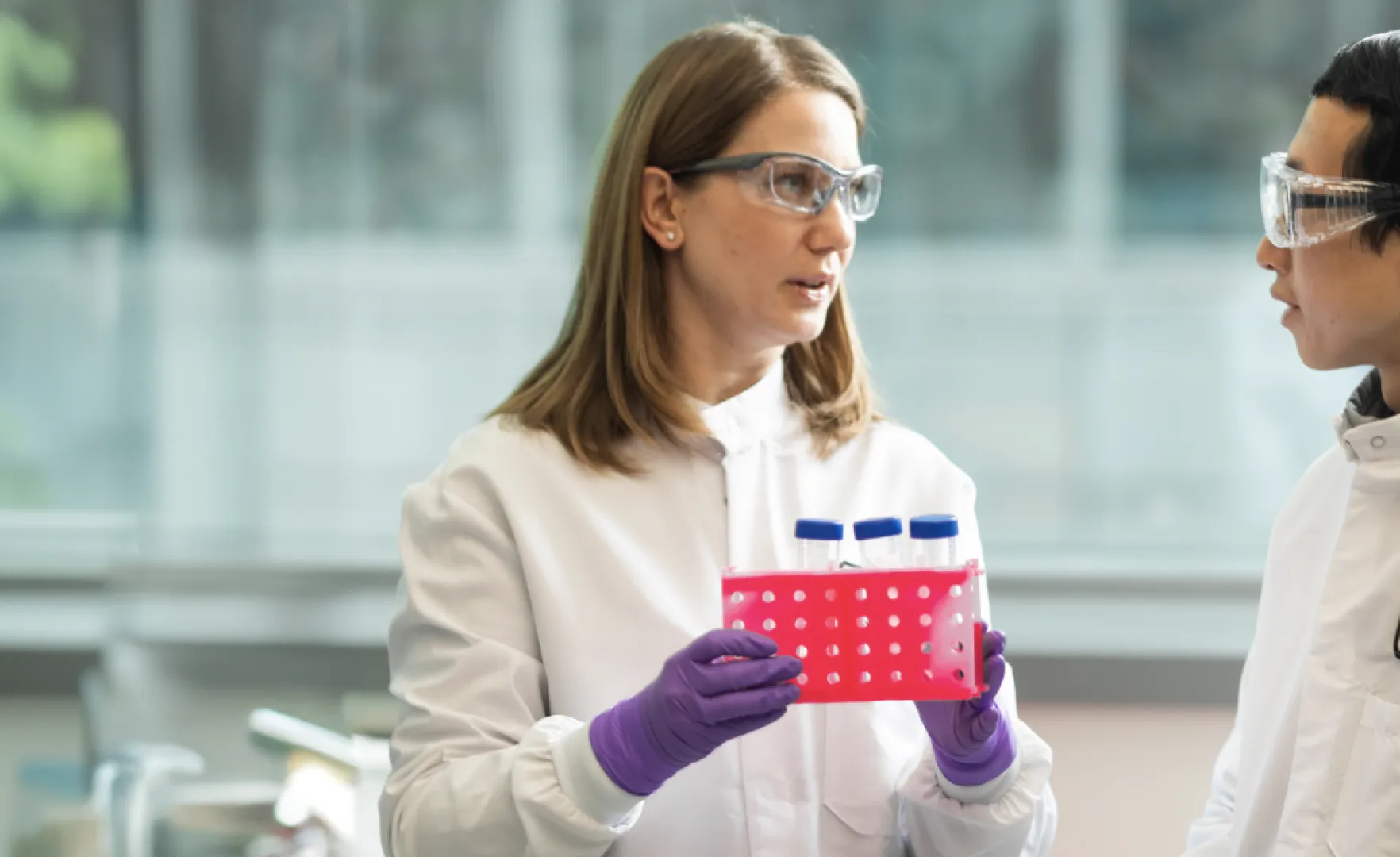 -Scientist-Holding-Container